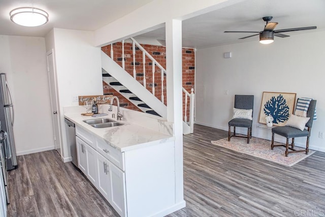 kitchen with white cabinetry, ceiling fan, dark hardwood / wood-style flooring, dishwasher, and sink