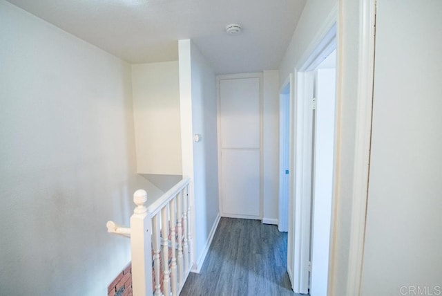 corridor featuring dark hardwood / wood-style flooring