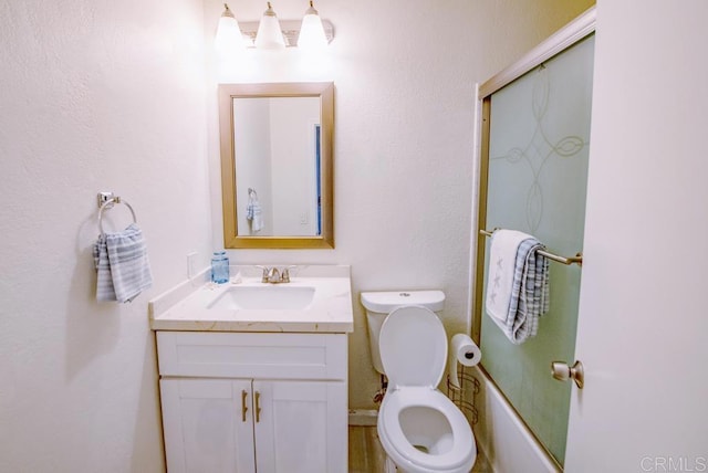 full bathroom with toilet, vanity, and combined bath / shower with glass door