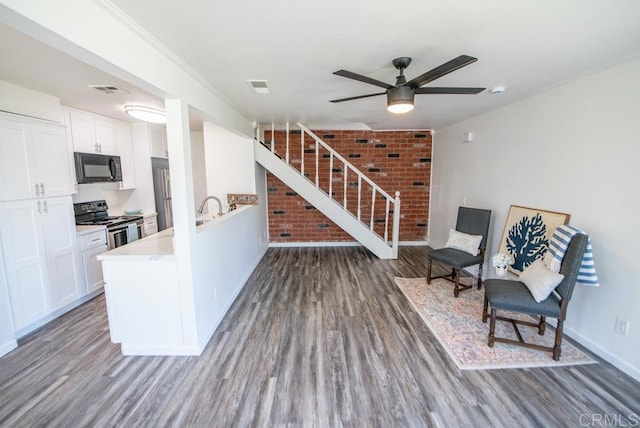 kitchen with ceiling fan, white cabinetry, dark hardwood / wood-style floors, and electric range