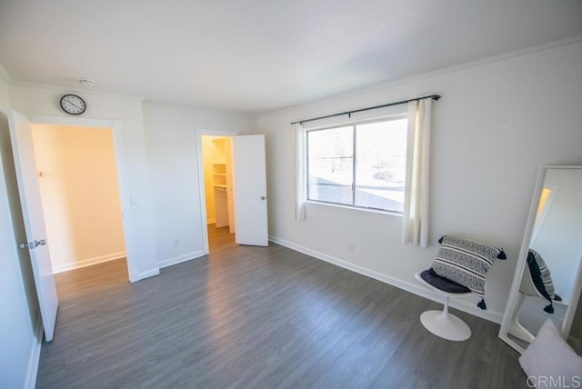 unfurnished bedroom featuring dark wood-type flooring and ornamental molding