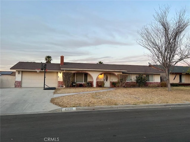 ranch-style home with a garage