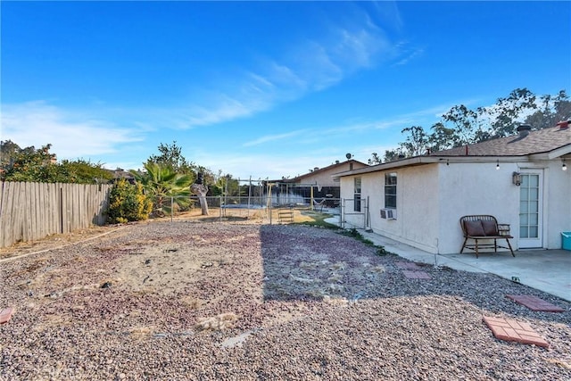 view of yard featuring cooling unit and a patio area