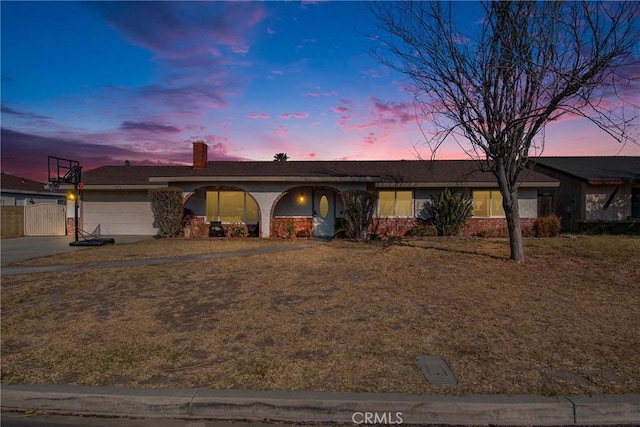 single story home featuring a garage