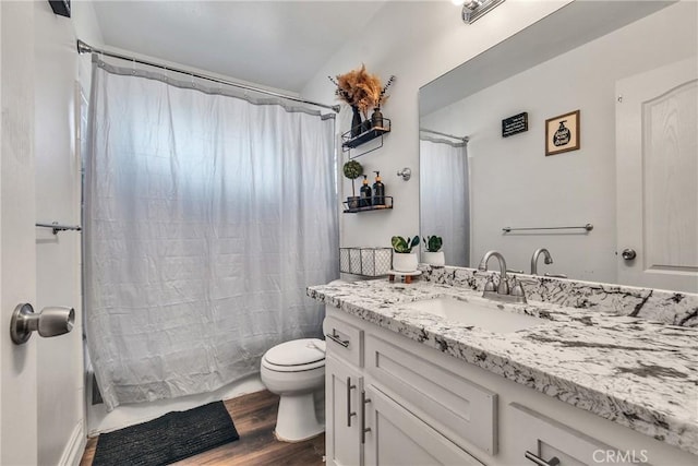 full bathroom with toilet, vanity, shower / tub combo, and hardwood / wood-style flooring