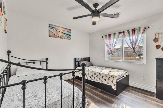 bedroom with ceiling fan and wood-type flooring