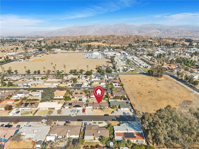 birds eye view of property featuring a mountain view