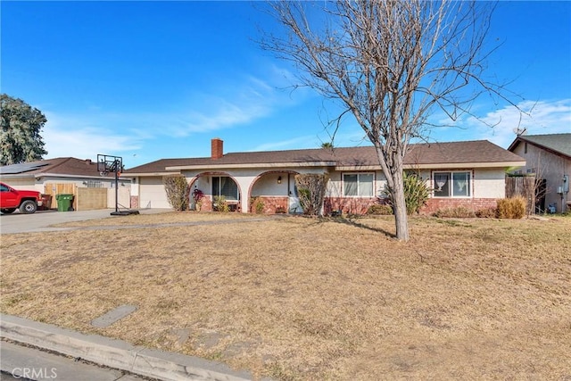 ranch-style home with a garage