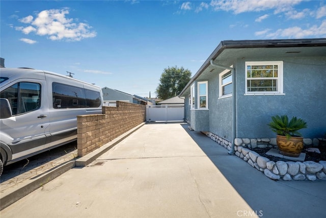 view of property exterior featuring a patio area