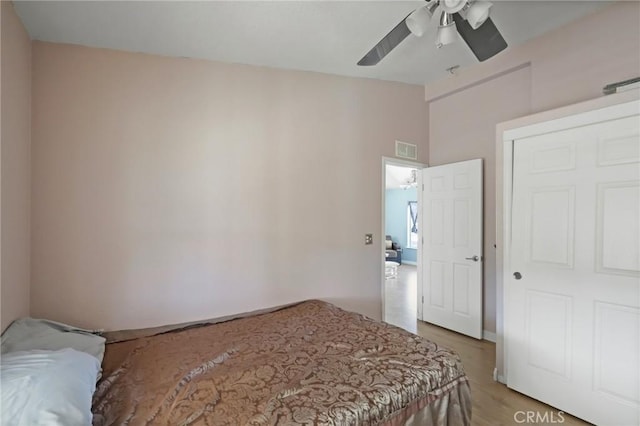 bedroom featuring ceiling fan and hardwood / wood-style floors