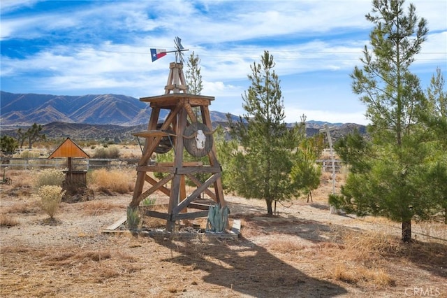 view of jungle gym featuring a mountain view