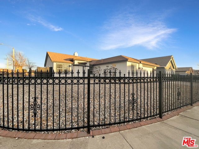 view of gate with a garage