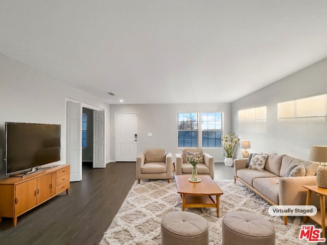 living room featuring dark wood-type flooring