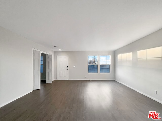 empty room featuring dark hardwood / wood-style floors