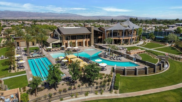 birds eye view of property with a mountain view