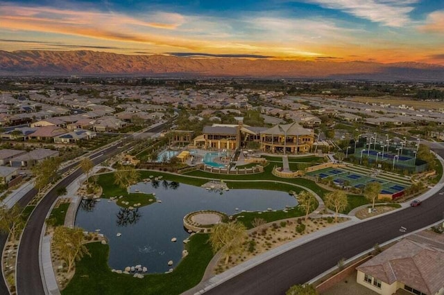 aerial view at dusk with a water and mountain view