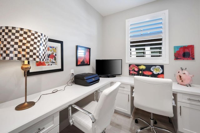 office space with light wood-type flooring