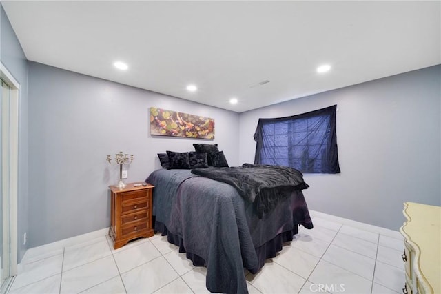 bedroom featuring recessed lighting, baseboards, and light tile patterned floors