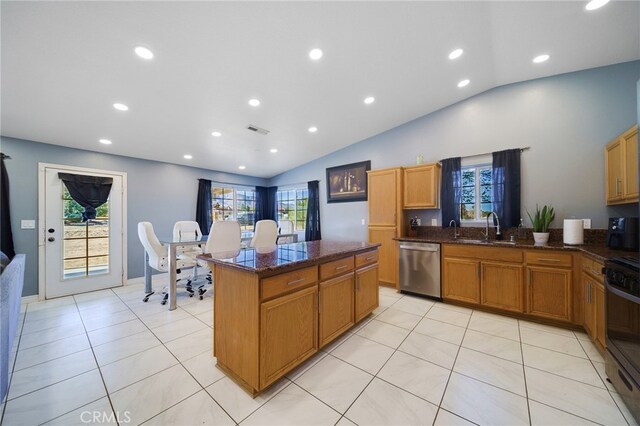 kitchen with sink, dark stone countertops, dishwasher, and vaulted ceiling