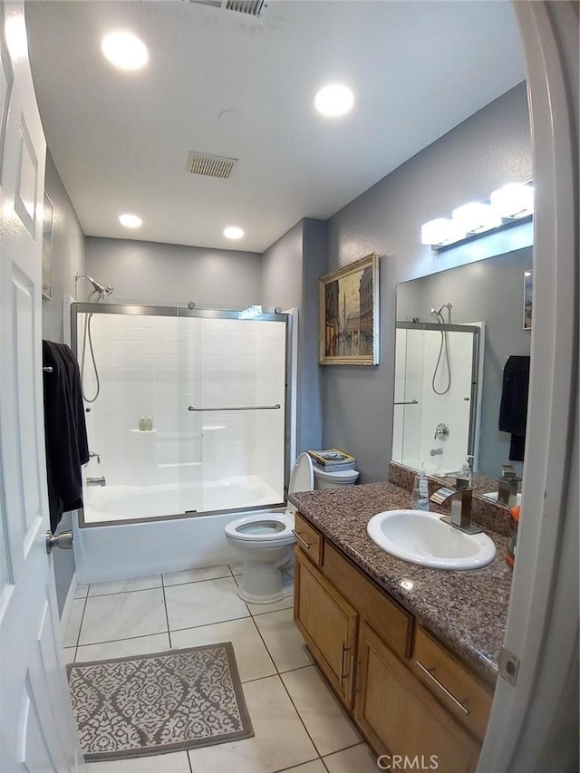 full bathroom with toilet, vanity, tile patterned flooring, and shower / tub combination