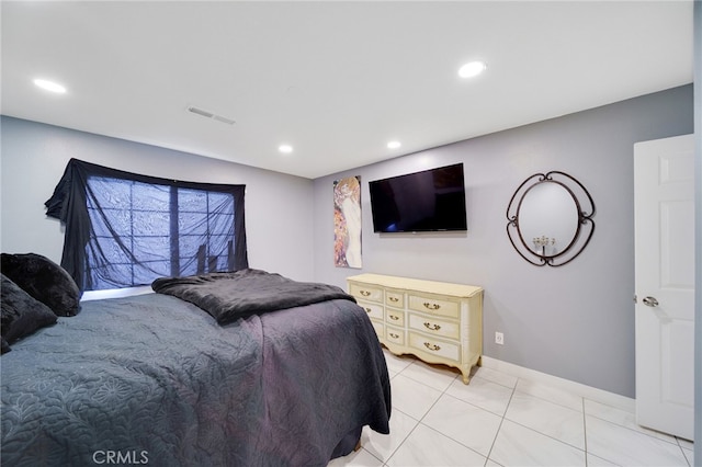 bedroom with light tile patterned floors