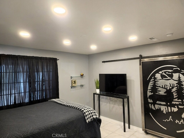 bedroom featuring visible vents, tile patterned flooring, recessed lighting, and a barn door