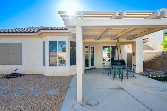 view of patio / terrace with a pergola and french doors