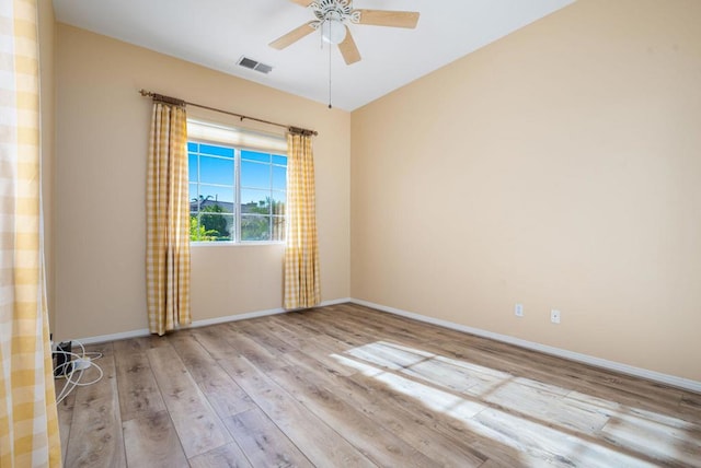 unfurnished room with ceiling fan and light hardwood / wood-style flooring