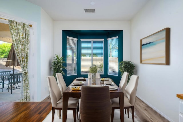 dining room with hardwood / wood-style floors