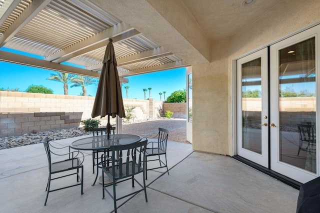 view of patio / terrace with french doors and a pergola