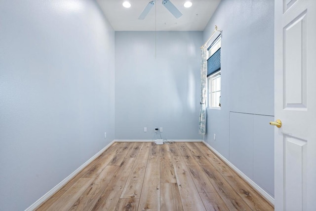 spare room featuring ceiling fan and light hardwood / wood-style flooring