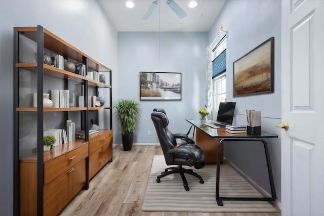 office featuring ceiling fan and light hardwood / wood-style flooring