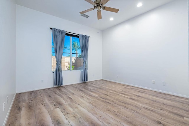 spare room with ceiling fan and light hardwood / wood-style flooring