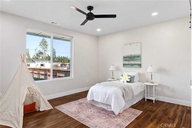 bedroom featuring dark wood-type flooring and ceiling fan