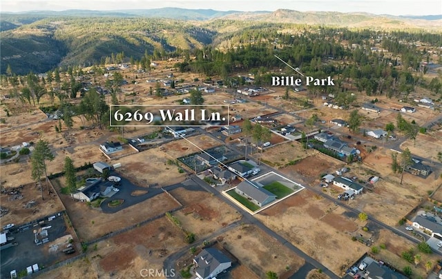 birds eye view of property with a mountain view