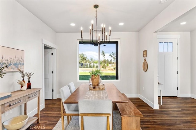 dining area featuring a chandelier and dark hardwood / wood-style flooring