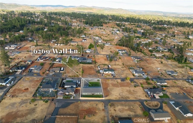 birds eye view of property featuring a mountain view