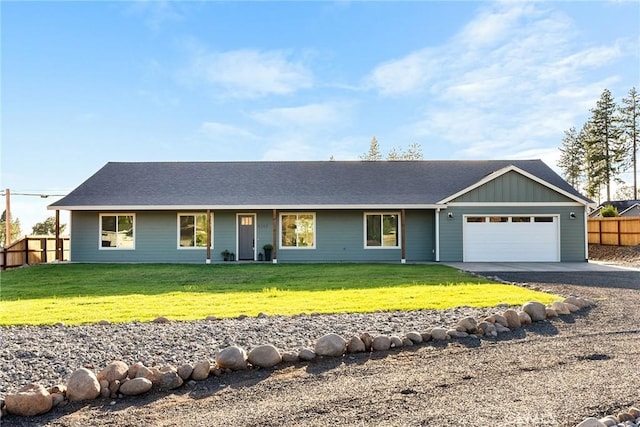 ranch-style home with a garage and a front yard