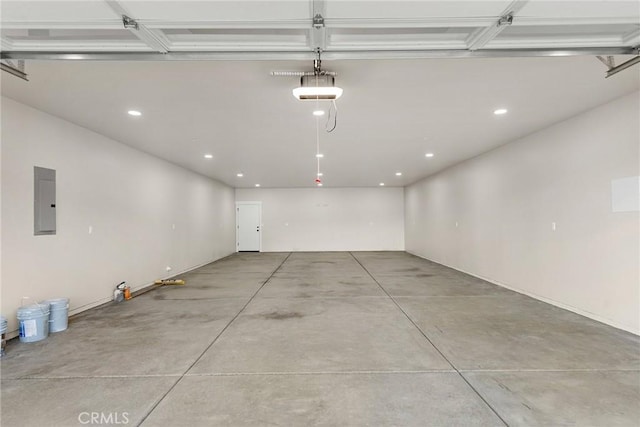 garage featuring electric panel and a garage door opener