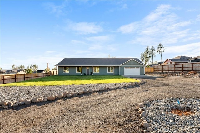 view of front facade with a garage and a front lawn