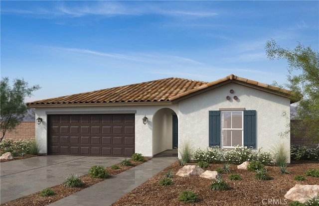 mediterranean / spanish-style house featuring a garage