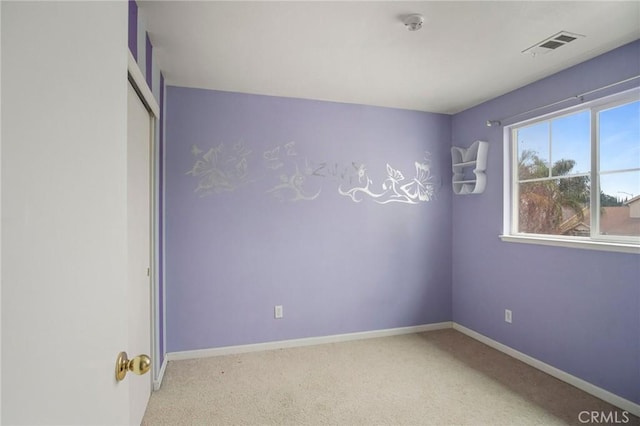 empty room featuring light colored carpet