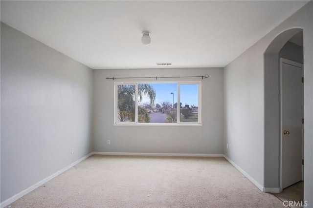 empty room with light colored carpet