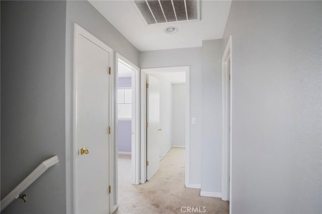 corridor with light carpet