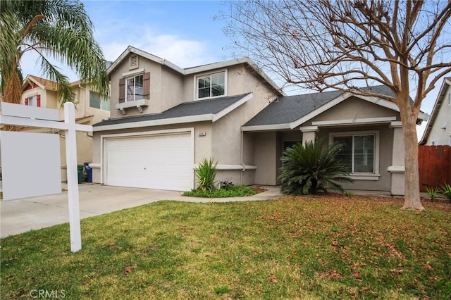 view of front facade with a front yard and a garage