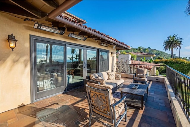 view of patio featuring an outdoor hangout area and a balcony