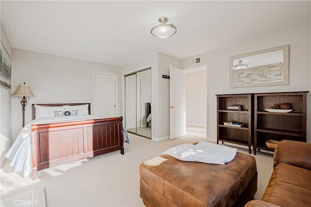 carpeted bedroom with a closet