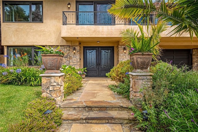 doorway to property featuring french doors and a balcony