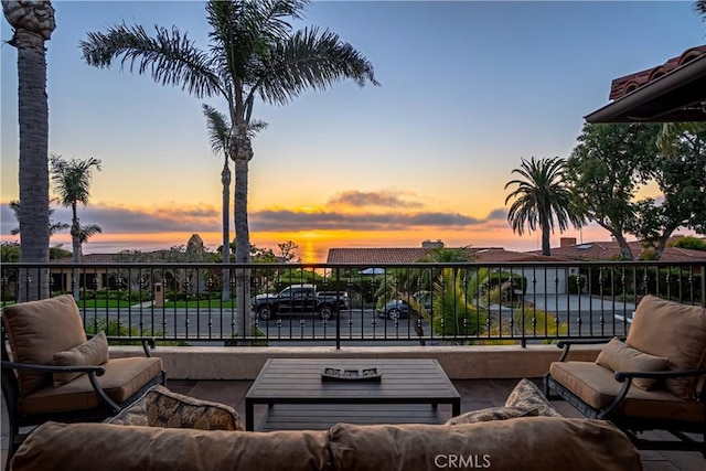 patio terrace at dusk with a balcony