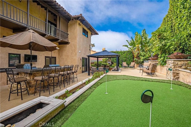 view of community with a gazebo and a patio